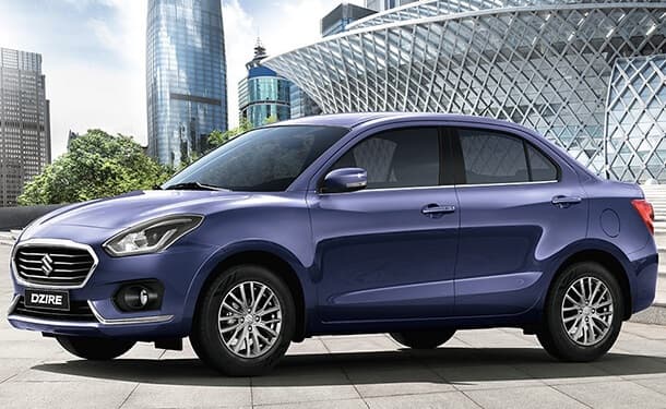 سياره-سوزوكي-ازرق-مباني-اشجار